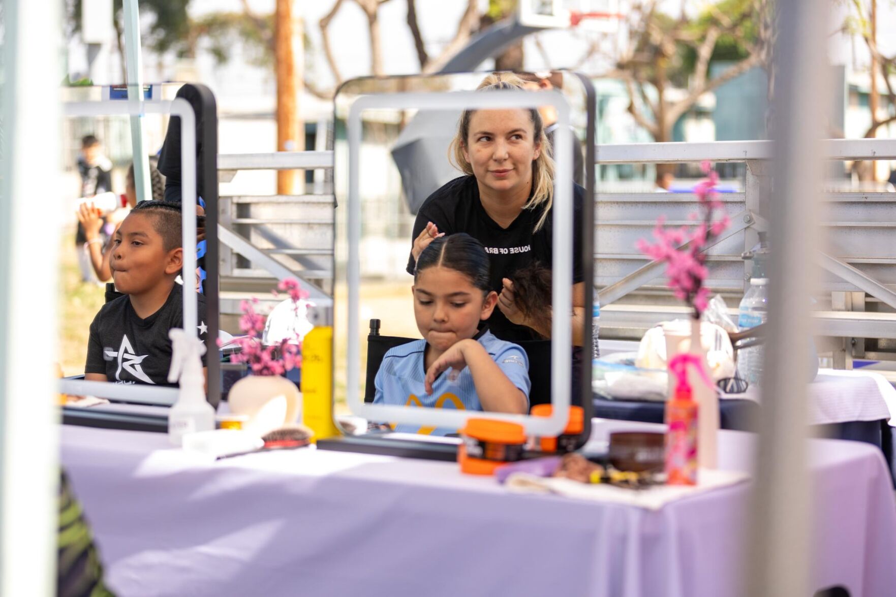 HouseofBraid-stylist-braiding-young-girls-hair-Courtesy-of-ImagerybyOscar